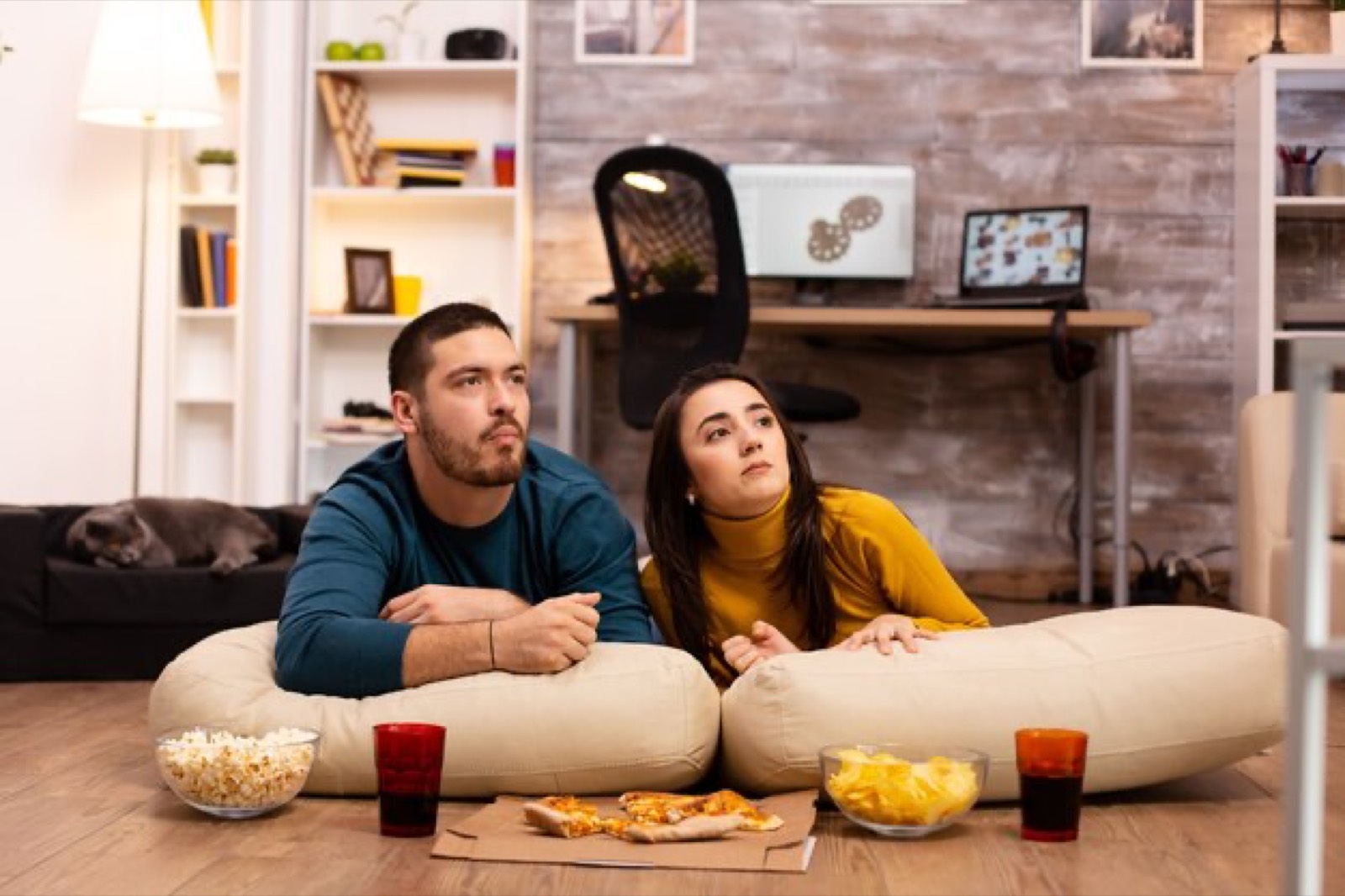 Couple setting up Rapid IPTV on their living room TV